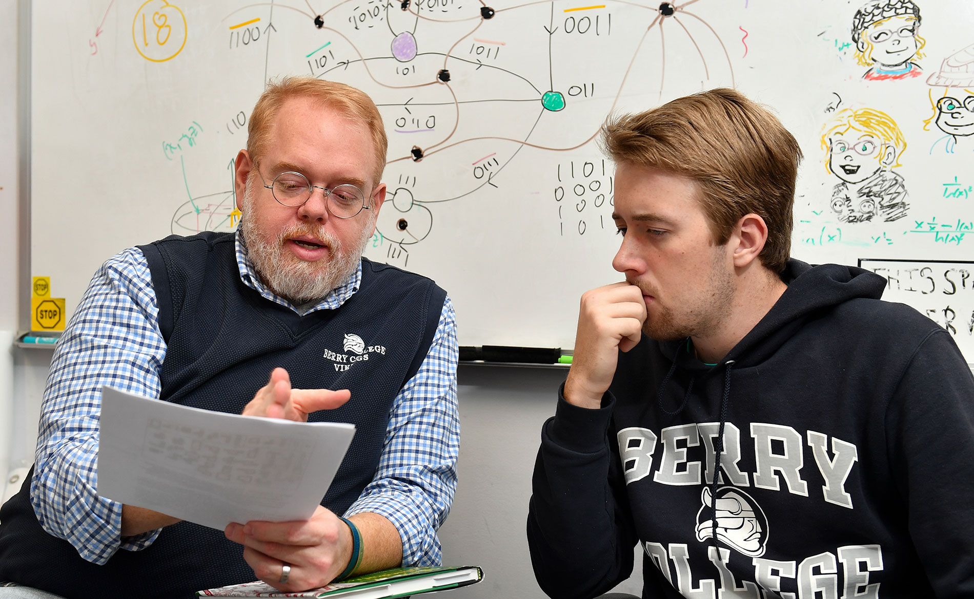 A student and a professor working together