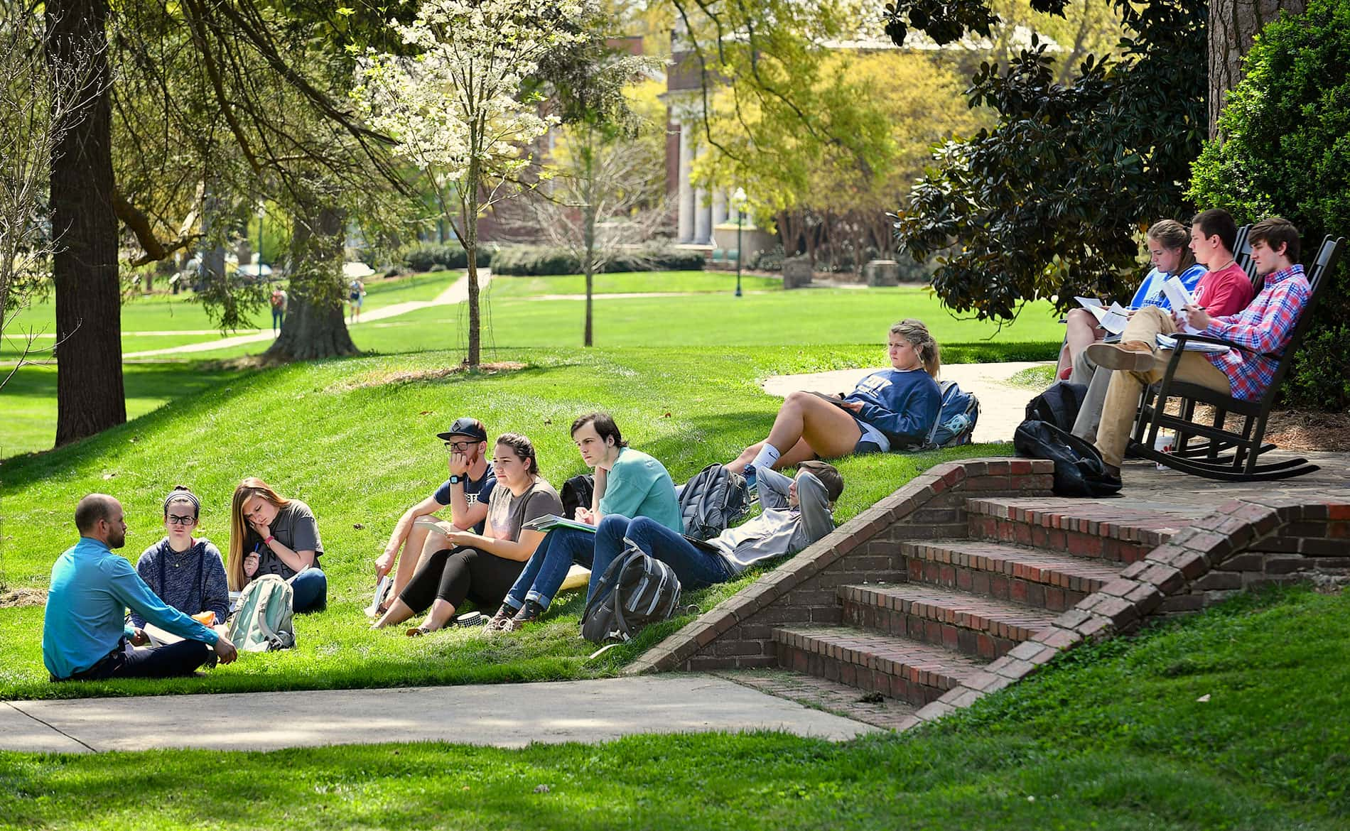 Professor teaching outside the Evans building