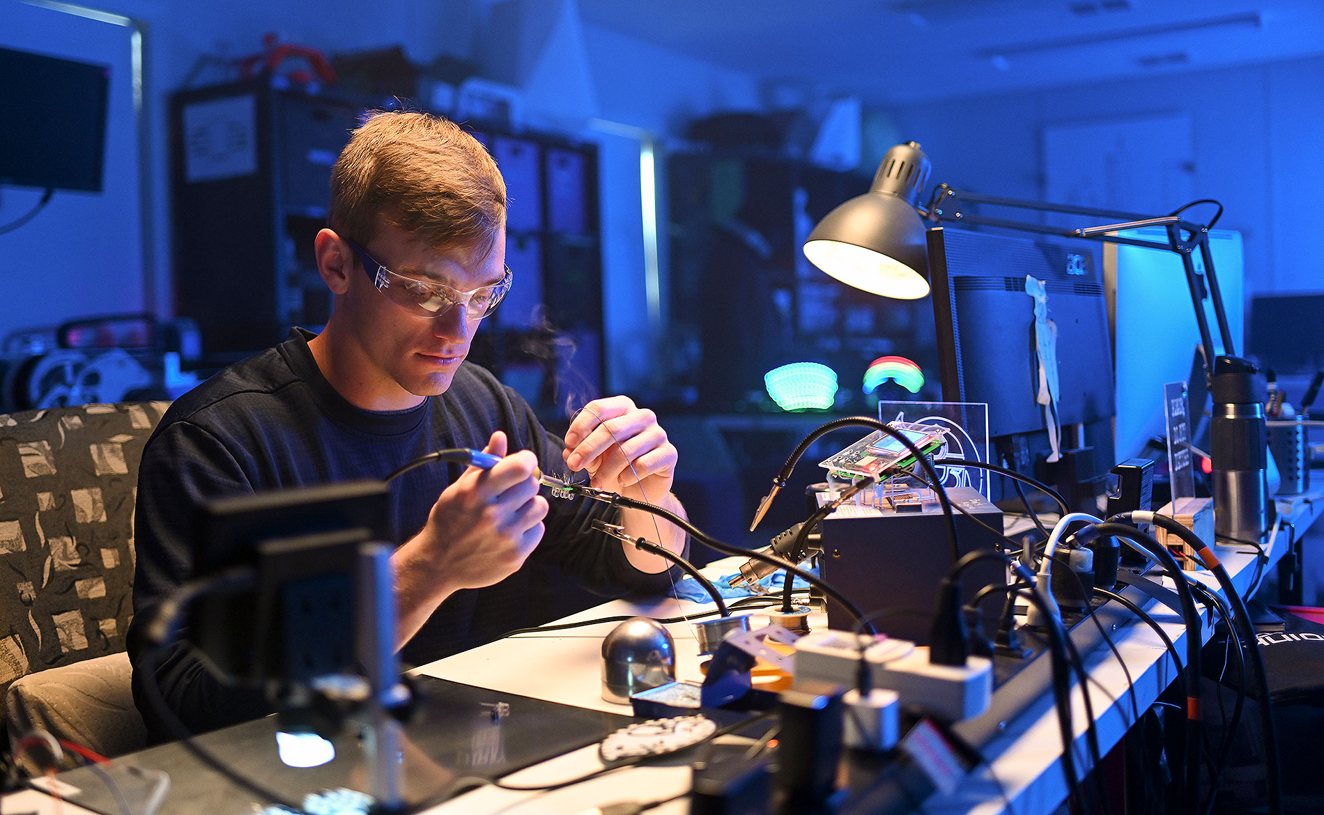 A Student making a circuit board