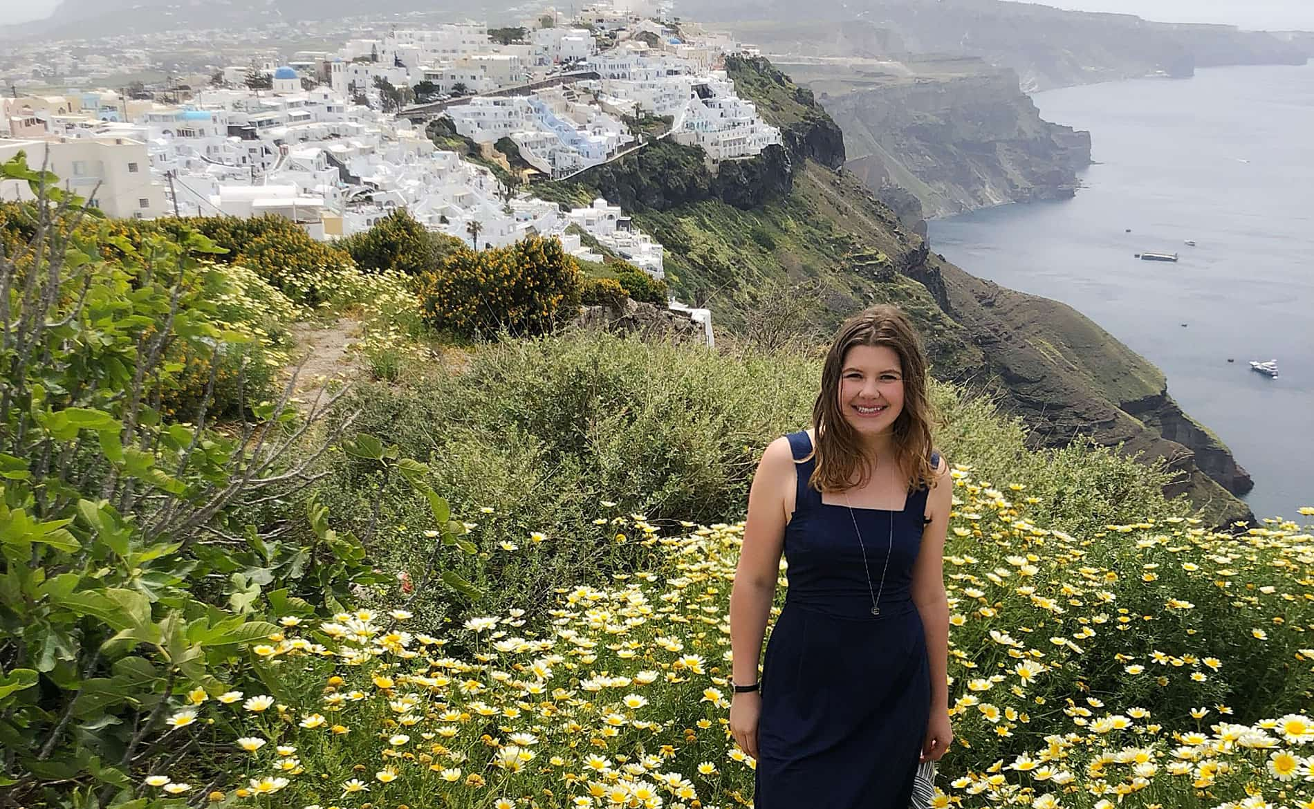 Female student on a cliffside while studying abroad