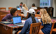 Three students in the library