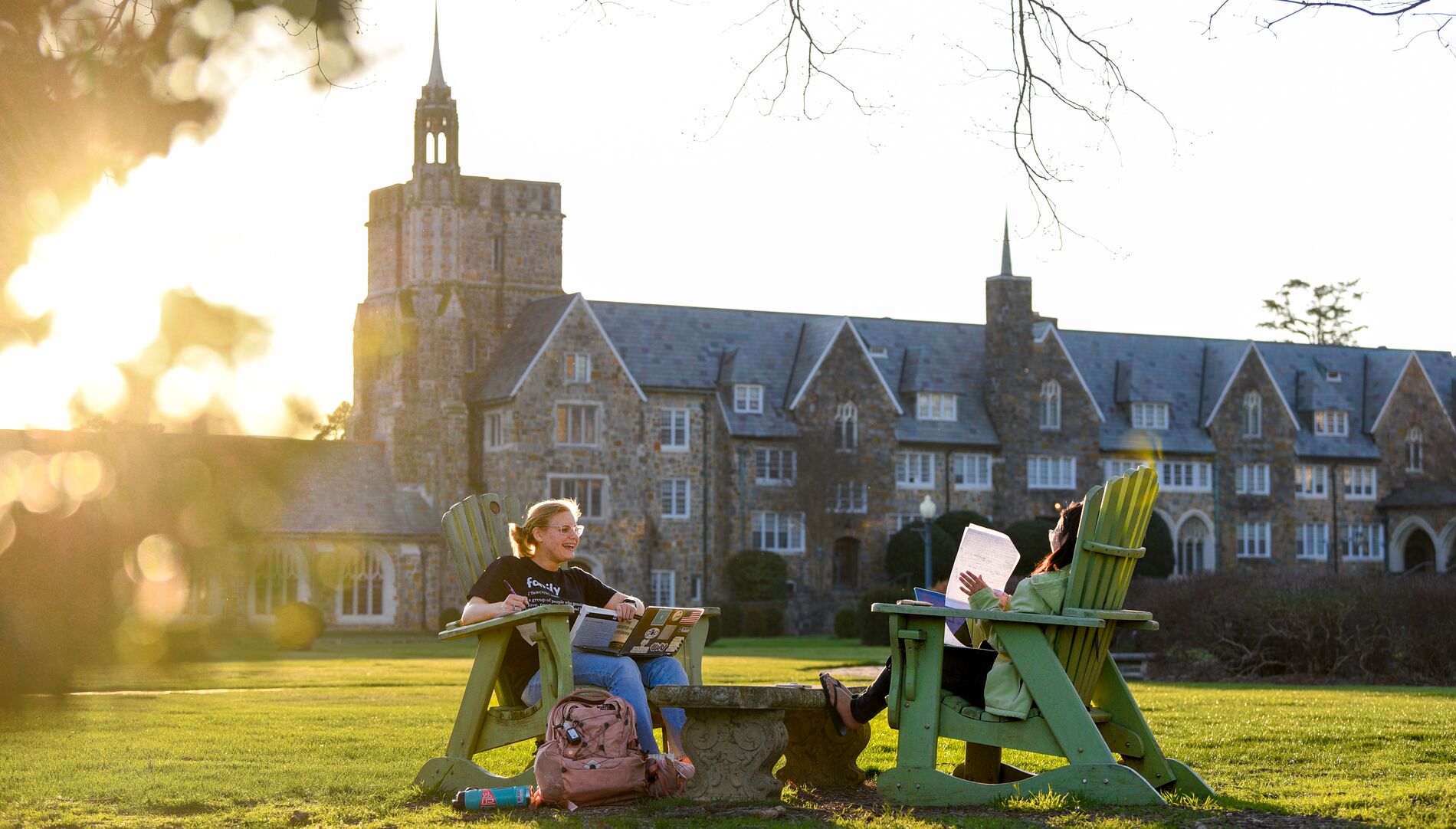 Student sitting in a chair on campus